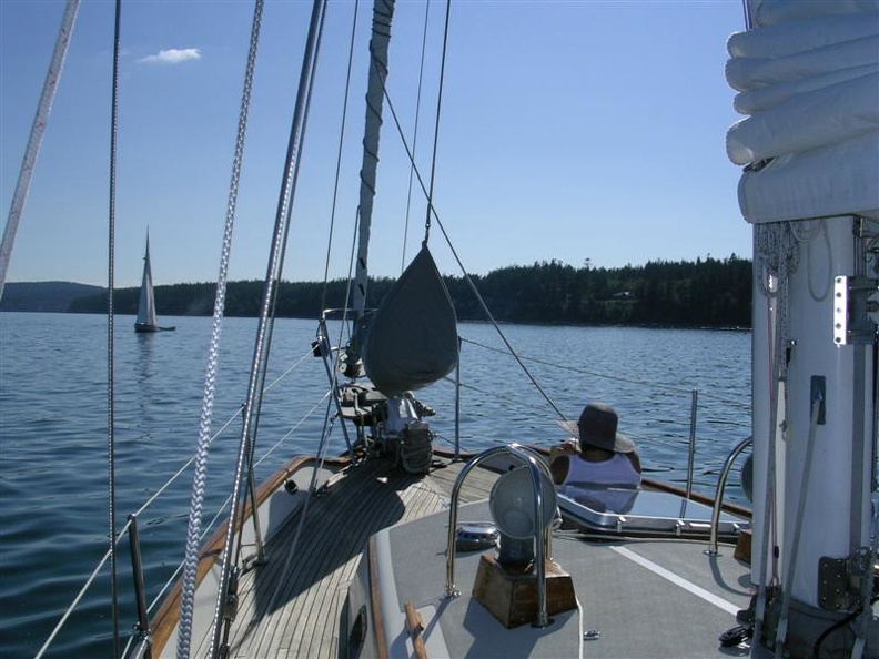 Cindy relaxing on the foredeck at Spencer Spit.jpg
